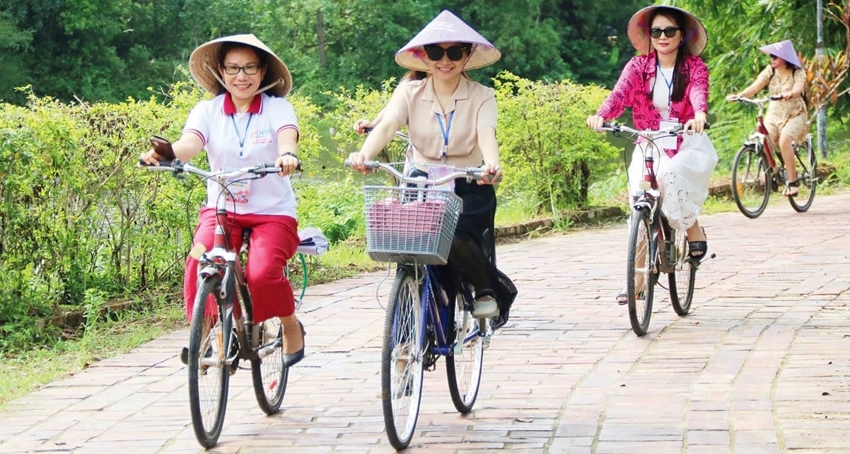 Experiencing riding bicycles in Phuoc Tich Ancient Village 