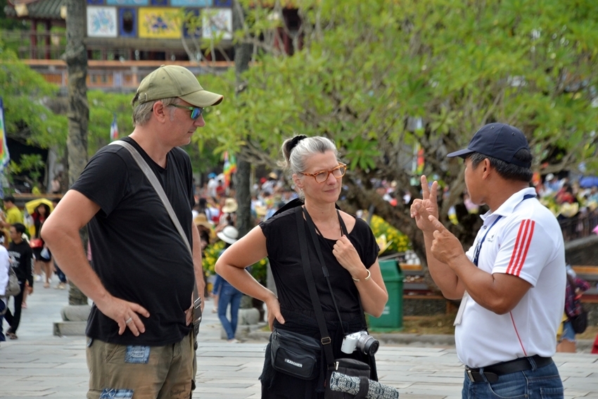  International tourists learning about the relics in Hue