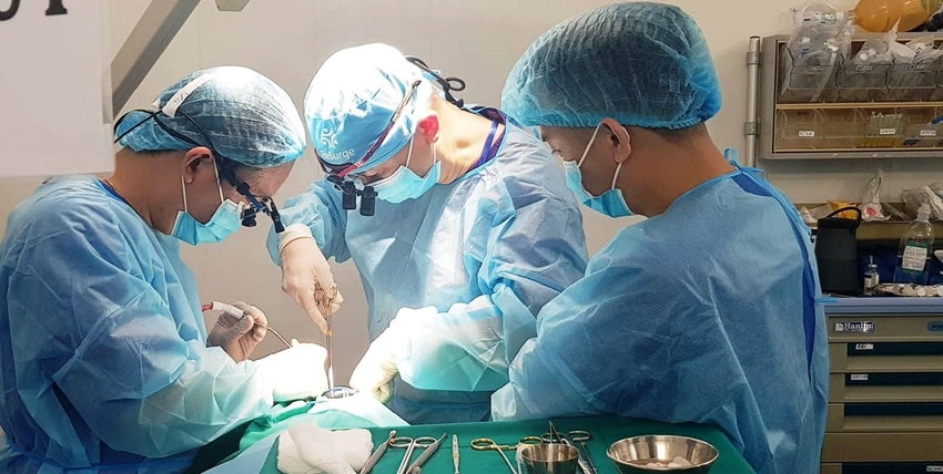  An expert performing surgery for a pediatric patient with cleft lip
