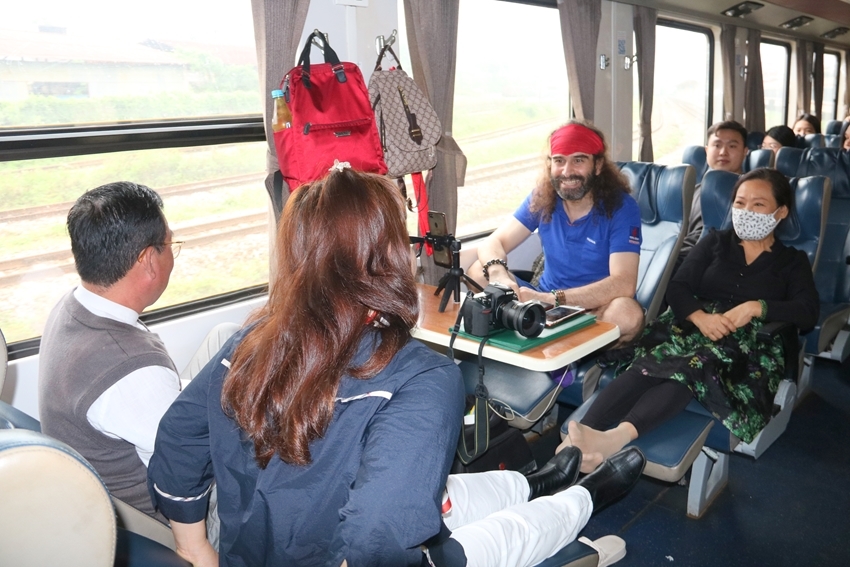 Passengers enjoying and chatting on the train