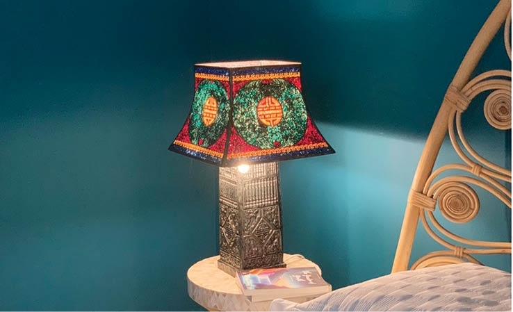 A decorative table lamp with a base made from Viet Kim Dieu