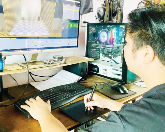  Anh Gia Huy, một trong những điển hình làm việc từ xa. Trong ảnh, anh Huy đang làm công việc cho một công ty kiến trúc ở Mỹ. Ảnh: Thu Hằng