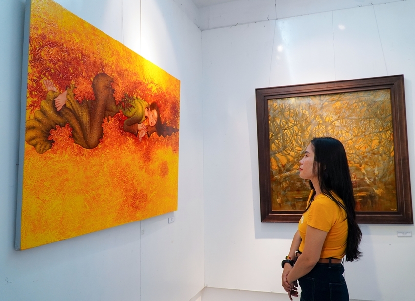 A viewer was admiring works with a contemporary feel