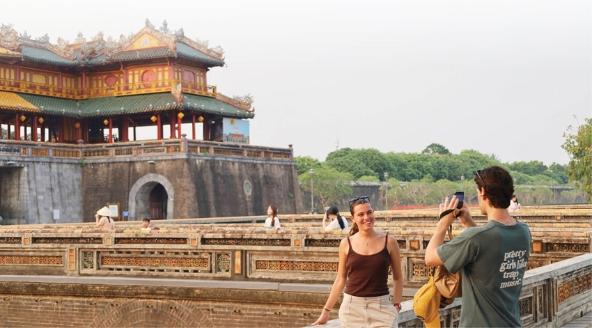 Visitors posing for photos in front of the Imperial Citadel